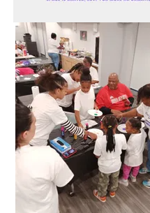 Families gathered around activity tables