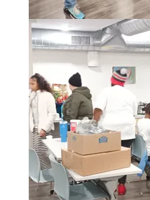 Volunteer working at a One Pulse community table