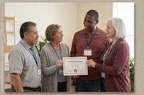 Peer-support participants recognizing progress in a community room